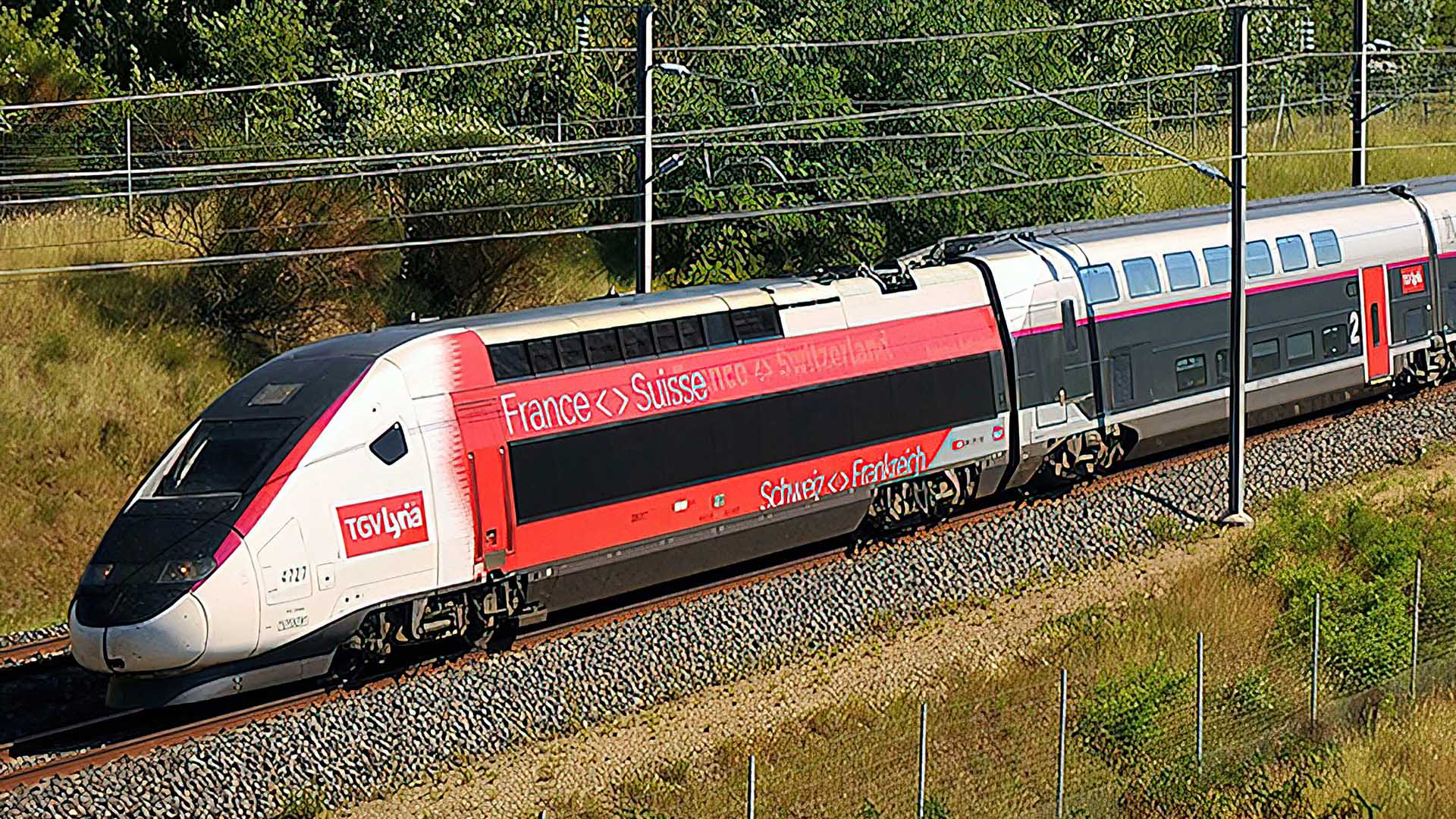 Un treno TGV Lyria in viaggio attraverso la campagna